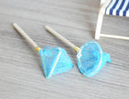 1:12 scale miniature fishing nets in blue with wood handles, set of 2, shown on a gray wood floor