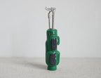 1:12 scale miniature green golf bag with 3 silver clubs, set of 4, standing upright on a white background