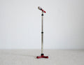 1:12 scale miniature microphone with tall silver stand and red tripod base, shown standing against a white background
