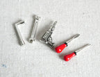 1:12 scale miniature metal hand tool set of 5 with red handled screwdrivers, wrench and hex keys, laid out on white fabric