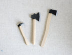 1:12 scale miniature garden tools with wood handles and black heads, axe, hatchet and hoe, set of 3, on linen