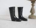 1:12 scale miniature black rubber rain boots, one pair, tall style, shown standing on a white surface