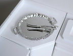 1:12 scale miniature metal turkey serving platter with carving knife and fork in silver, set of 3, on a white counter
