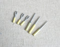1:12 scale miniature metal BBQ grill tools, set of 6 with pale yellow handles, laid out on linen fabric