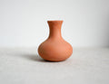 1:12 scale miniature terracotta clay vase with flared neck and round body, shown on a white surface