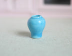 1:12 scale miniature glazed ceramic ginger jar vase in light blue with a glossy finish, shown on a pale surface