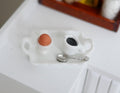 1:12 scale miniature white breakfast tray with boiled egg in egg cup, coffee and spoon, shown on a white counter
