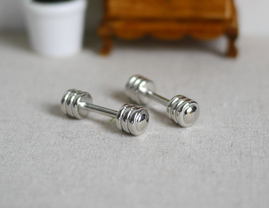 1:12 scale miniature metal dumbbells in silver with ribbed ends, set of 2, shown on a gray floor