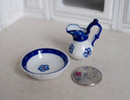 1:12 scale miniature porcelain pitcher and wash basin in blue and white with flower motif, set of 2, beside a coin