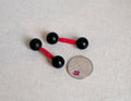 1:6 scale miniature black dumbbells with red bars, set of 2, round ball ends, shown beside a coin for scale