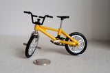 Dollhouse outdoor decoration miniature small size freestyle bike 1:12 scale cross bicycle front and rear pegs no brakes (Yellow) B008