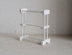1:12 scale miniature freestanding towel rack in white with 3 bars, shown on a light gray surface
