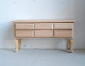 1:12 scale miniature unpainted wood foyer table with 6 drawers and short cabriole legs, shown against a white wall