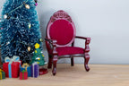 1:12 scale miniature wood armchair with red velvet seat and oval back, mahogany finish, shown beside a small Christmas tree