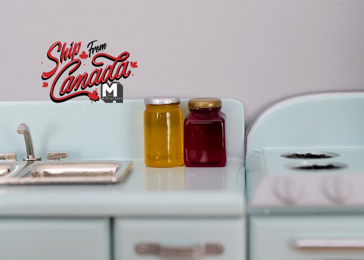 1:12 scale miniature honey and fruit jam jars with lids, set of 2, amber and dark red, on a mint kitchen counter