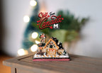 1:12 scale miniature Christmas gingerbread house with white iced roof and candy decorations, shown on a wood table
