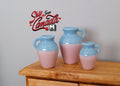 1:12 scale miniature stoneware jugs, set of 3 in light blue and pink two tone glaze with handles, on a wood dresser