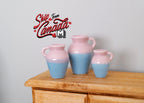 1:12 scale miniature stoneware jugs and crocks in pink and blue two tone glaze, set of 3, on a wood dresser