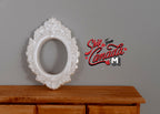 1:12 scale miniature ornate oval photo frame in pearl white, large, shown standing on a wood dresser