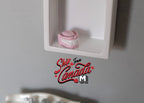 1:12 scale miniature dentures with pink gums and white teeth, shown on a white wall shelf