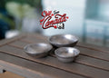 1:12 scale miniature aluminum nesting bowls, set of 3, graduated silver bowls shown on a gray wood table