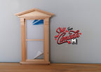 1:12 scale miniature Federal pediment window with acrylic pane, unpainted wood frame, shown against a gray wall
