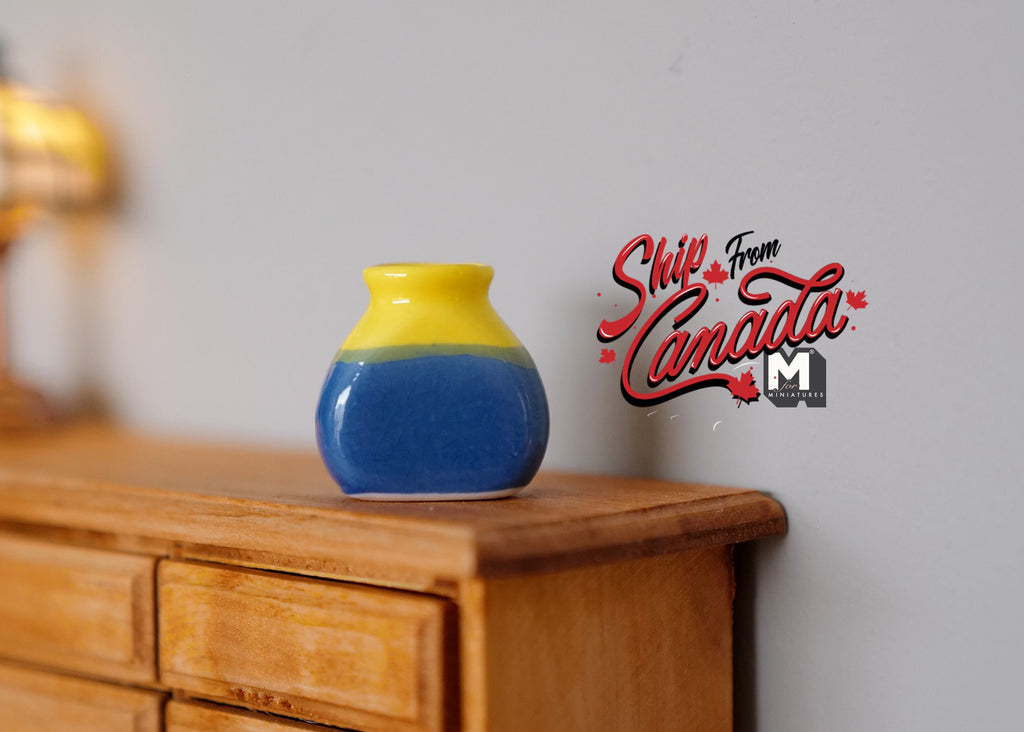 1:12 scale miniature ceramic plum vase with yellow and blue glaze, shown on a wood dresser