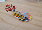 1:12 scale miniature artist palette with brushes and paint tubes fixed in place, colorful paint blobs, on a wood tabletop