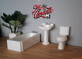 1:12 scale miniature bathroom set in white with bathtub, pedestal sink with faucet and toilet, set of 3, on a wood floor
