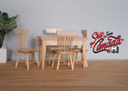 1:12 scale miniature unpainted wood dining table and 4 spindle back chairs, set of 5, shown beside a potted plant