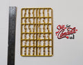 1:12 scale miniature alphabet letters and numbers in gold, A to Z and 0 to 9, set of 36 on a sprue, beside a ruler