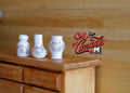 1:12 scale miniature ceramic vase set of 3 in pear, plum and rouleau shapes, white with blue floral, on a wood dresser