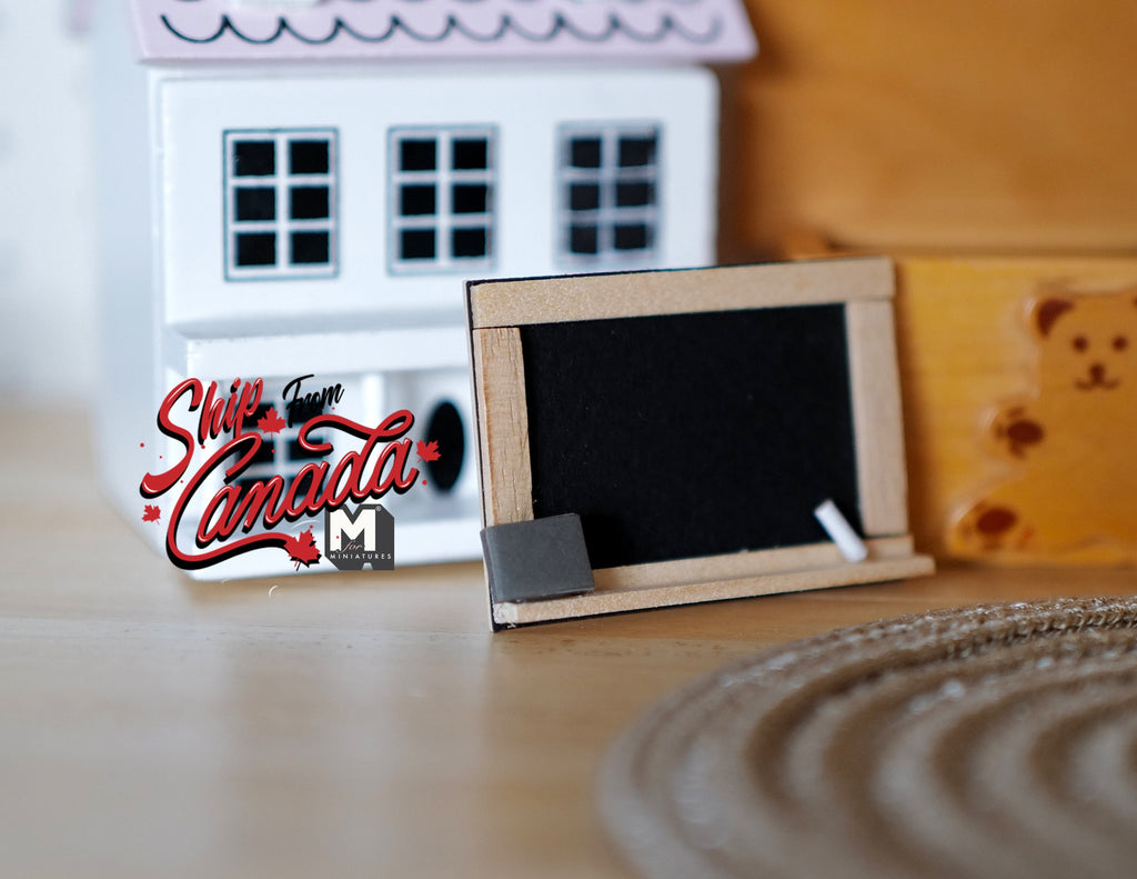 1:12 scale miniature wood framed blackboard on stand with chalk and eraser, shown on a wood table