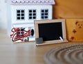 1:12 scale miniature wood framed blackboard on stand with chalk and eraser, shown on a wood table