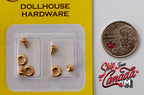 1:12 scale miniature brass fluted knobs with swirl backplates, set of 4, in clear packaging beside a coin for scale