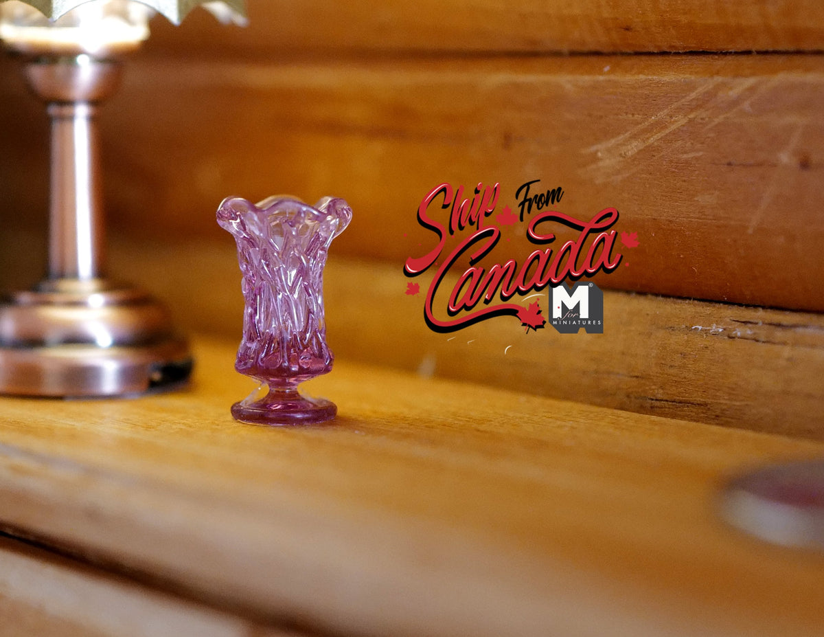 1:12 scale miniature pedestal vase in purple, translucent with fluted sides and wavy rim, shown on a wood table