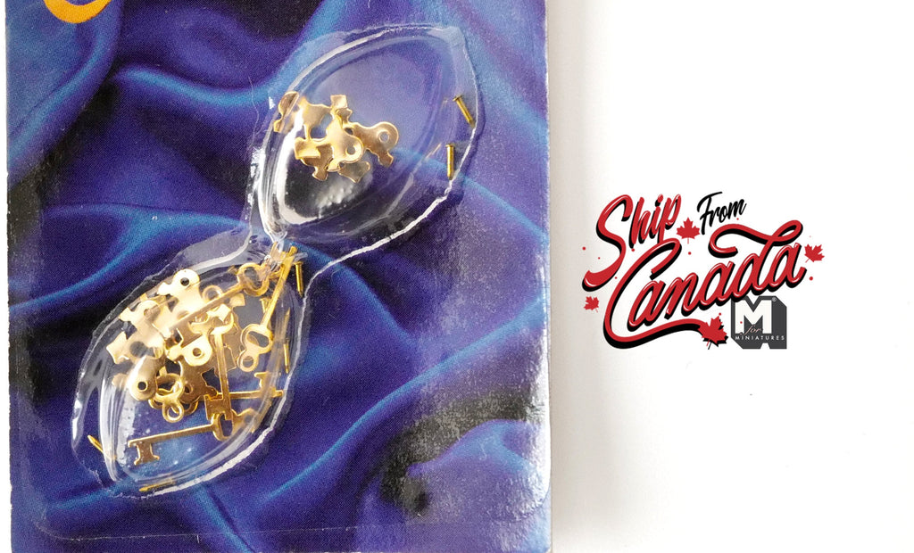 1:12 scale miniature brass keyhole plates with keys and nails, set of 6, shown in clear blister packaging
