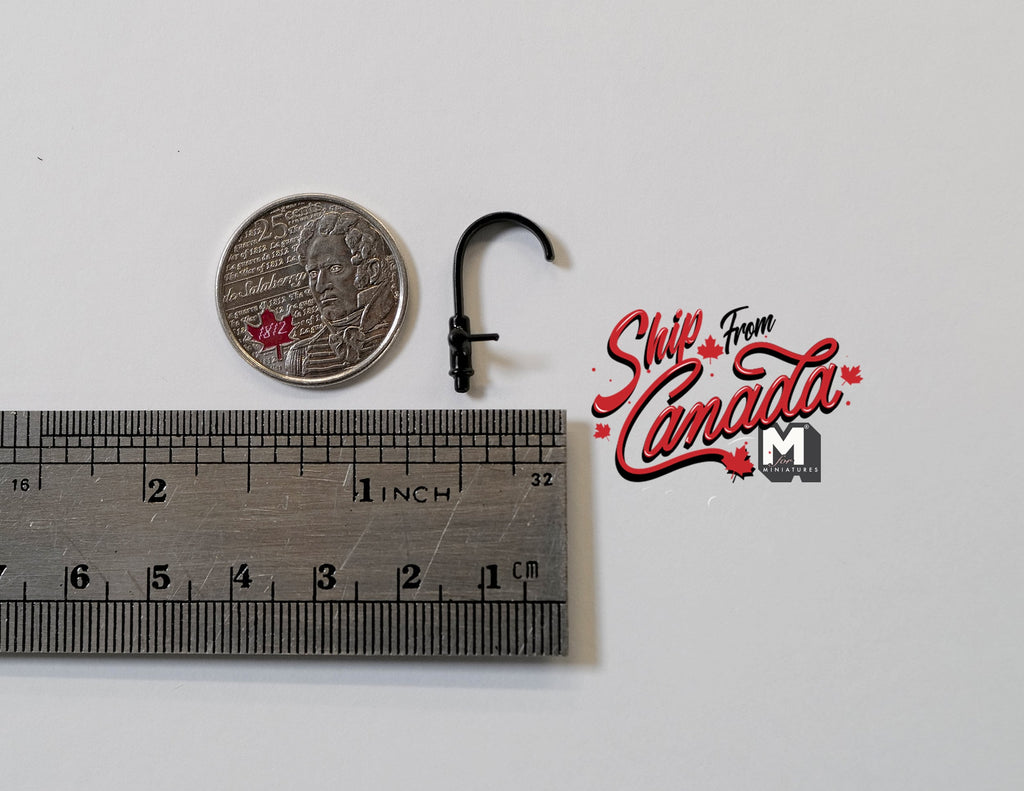1:12 scale miniature black single handle faucet with curved spout, shown beside a coin and a ruler