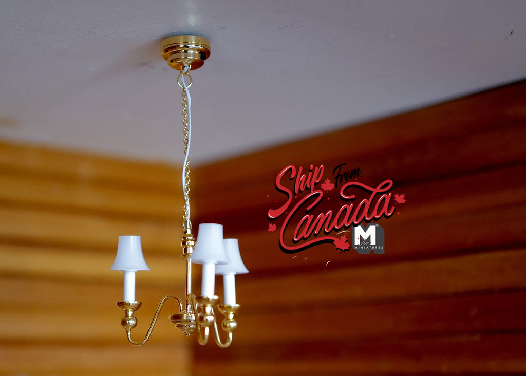 1:12 scale miniature LED 3 arm tulip chandelier in gold with white shades and on/off switch, hanging from a ceiling