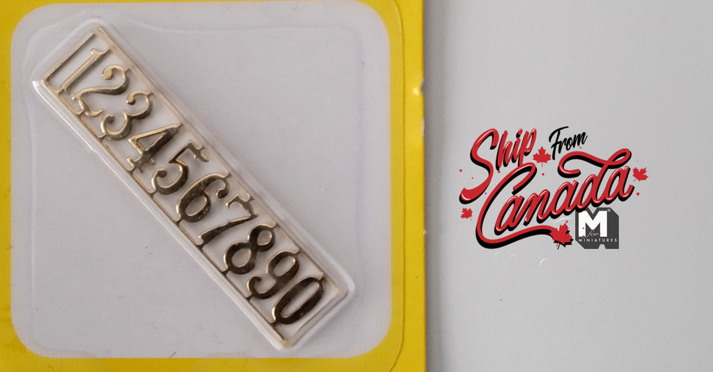 1:12 scale miniature brass house numbers 0 to 9, set of 10, gold tone digits shown in their backing card