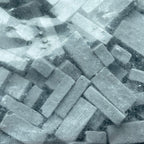 1:12 scale miniature charcoal bricks, pack of 325, dark gray loose bricks shown close up in a clear bag
