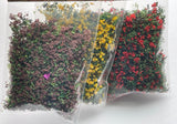 Dollhouse flowery loose blossoms mixed in with greenery, 3 packs - 1 each of purple, marigold & red - H037