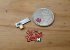 1:12 scale miniature padlock with hasp in silver and gold, shown on a wood surface beside a coin for scale