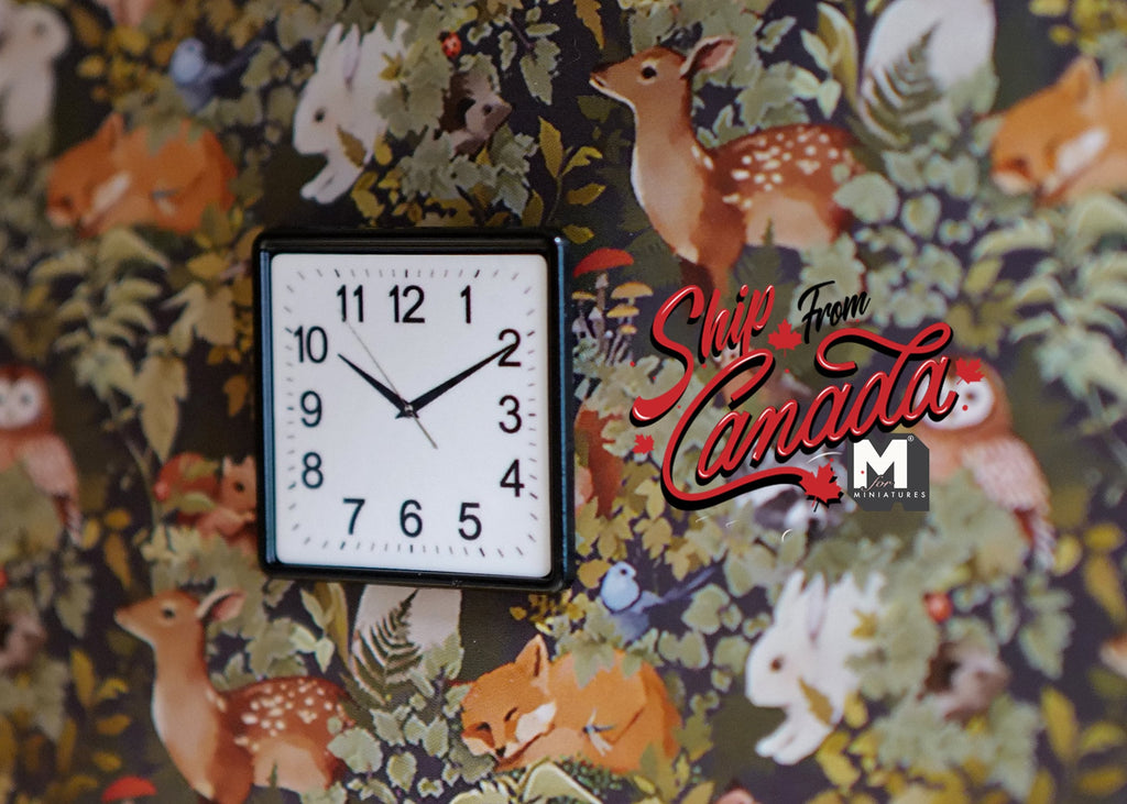 1:12 scale miniature square wall clock in black and white with printed numbers, non working, on floral wallpaper