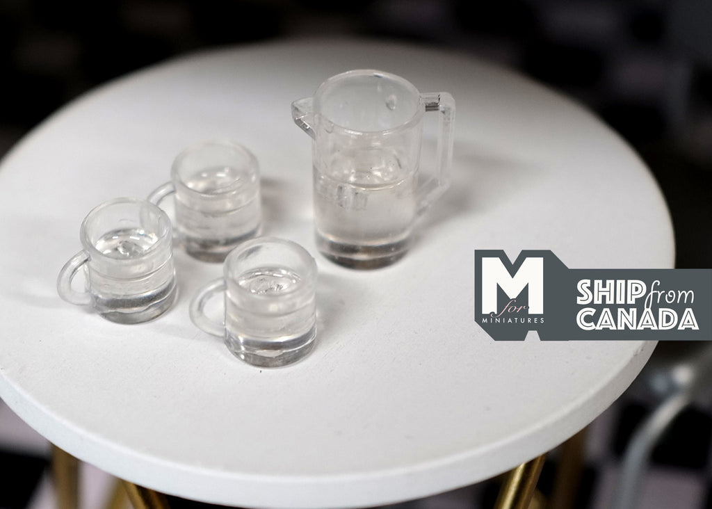 1:12 scale miniature clear ice water jar and 3 glasses with handles, set of 4, shown on a round white table