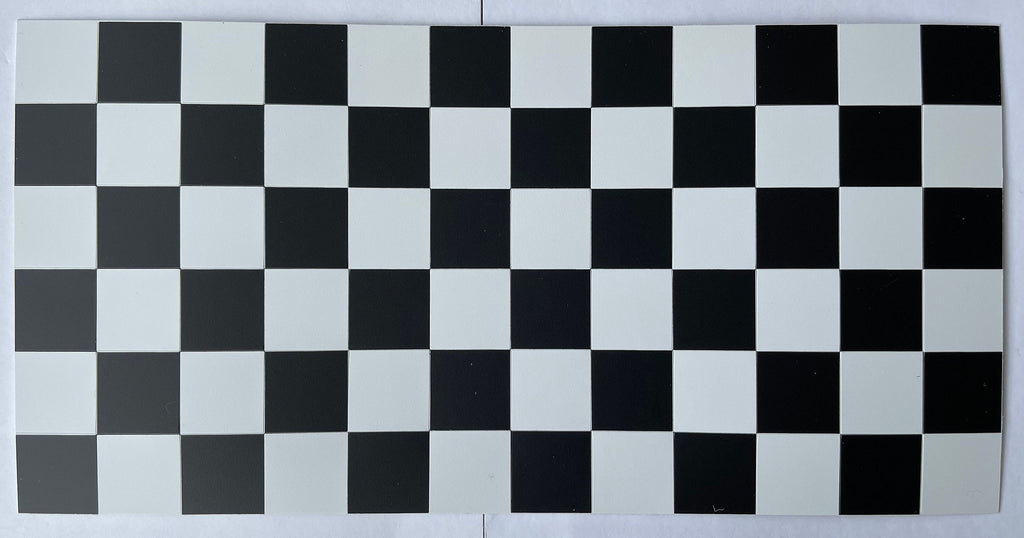 1:12 scale miniature black and white checkered floor tile sheet, 6 x 12 tiles, full sheet viewed from above