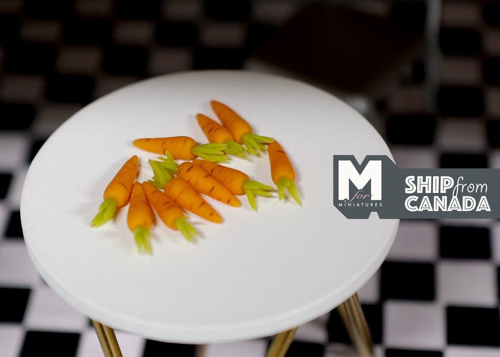 1:12 scale miniature carrots with green tops, set of 10, orange carrots piled on a round white table