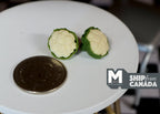 1:12 scale miniature cauliflowers with green leaves, set of 2, shown on a white round table beside a coin