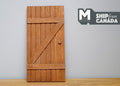 1:12 scale miniature stained wood farmhouse plank door with Z brace, warm brown finish, shown against a gray wall