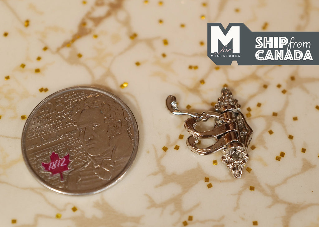 1:12 scale miniature silver metal triple coat hook with ornate scroll back, shown beside a coin for scale